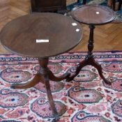 A modern mahogany circular tripod table, on claw feet with castors and another white table (2)