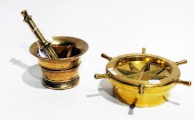 Brass mortar and pestle, and a brass ashtray in the form of a ship's wheel (3)