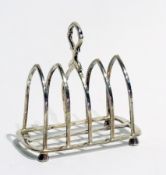 A George V silver four-division lancet-shaped toast rack, raised on faceted feet, Sheffield 1919,
