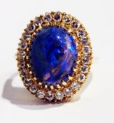 18K gold black opal and diamond dress ring, set large oval cabochon opal surrounded by claw set