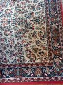 A Persian style wool carpet, ivory and red ground with foliate decoration, 160 x 250cm