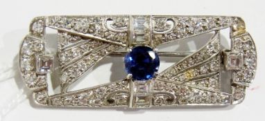 Art Deco diamond and sapphire brooch, shaped rectangular with central large circular sapphire,