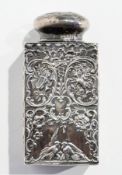 A silver square decanter, with overall floral and C-scroll repousse decoration, with London import