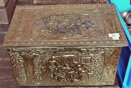 A brass-mounted box, with leaf decoration of figures enclosing a quantity of brass candlesticks,