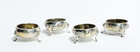 A set of four Victorian silver open salts, with foliate repousse decoration, raised on hoof feet,