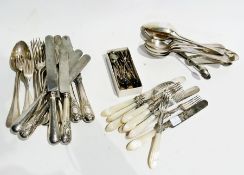 A quantity of silver plated flatware, to include an ice box, tablespoons, ladle, a large metal