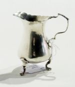 George V silver cream jug,  with cut card borders, scroll handle, raised on pad feet, Birmingham