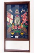 A needlework tapestry panel of the Wiltshire Regiment with union flags, peacocks and rose heads,