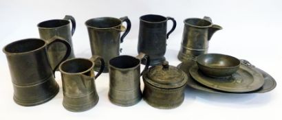 A collection of old pewter to include:- quart mugs and measures, circular dish and cover and