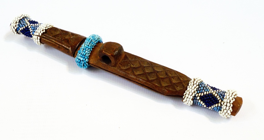 A carved wooden and beaded knife and sheath, possibly a Ndau from Zimbabwe, 20cm long