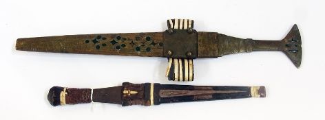 A West African metal dagger, with matching sheath together with another with a leather sheath,