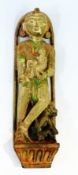 Hindu carved hardwood figure holding child, with monkey on plinth, 39cm long