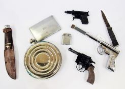 An old sheath knife with leather scabbard, a spring gun, toy revolver,  chrome cigarette case and