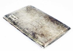 A silver cigarette case with engine turned engraving, and sprung hinge, Chester 1945, weight 6oz,