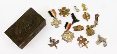 A small quantity of military badges, various to include:- German, American, British, etc. in a box