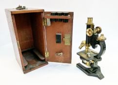 A R&J Beck microscope, with additional lenses in a fitted mahogany case