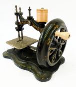 Black and gilt painted tailor's "twisted loop" sewing machine, on serpentine base (boxed) and