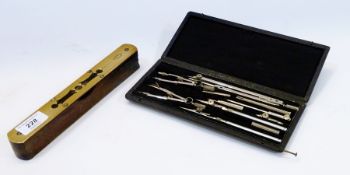 A set of draughtsman's instruments, boxed, together with a brass faced spirit level