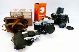 A Zenith 35mm SLR camera, a Werra camera (boxed), a Praktica 35mm camera and other camera equipment