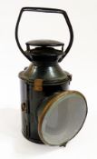 An old British Railway tri-colour enamelled tin lamp, the rotating handle changing the lamp colour