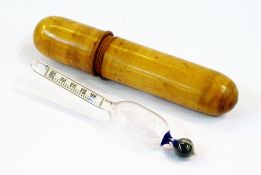 A Victorian specific gravity of liquid measure within a turned boxwood case
