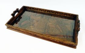 A carved Indian/Polynesian hardwood tray depicting mermen, figures and alligators, rectangular-