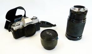 A Minolta X300 35mm SLR camera together with a 28-200mm zoom lens and another lens in a case