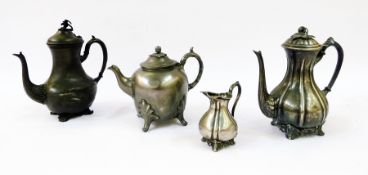 A late 19th century pewter teapot together with a pewter coffee pot and a base metal coffee pot