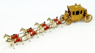 A die-cast model of the 1953 Coronation Coach with eight horses and out-riders, length 38cm