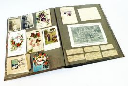 Early 20th century scrapbook to include:- Christmas and greeting cards, pictures, programmes,