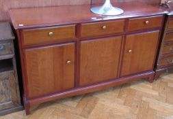 A Stag sideboard of three drawers and three cupboards on bracket feet, 140cm wide
