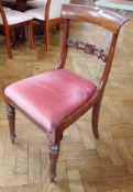 Set of four William IV/early Victorian mahogany dining chairs, each with curved shoulder board,