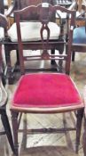 An Edwardian mahogany bedroom chair, with pierced back, upholstered seat, on turned supports and