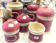 A quantity of old ceramic pink and white glazed kitchen jars and a small Victorian terracotta