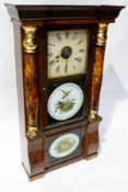 American eight-day wall clock in architectural style case with shaped pediment, pair faux figured