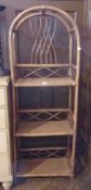 A cane three-tier bookcase, a carved wood occasional table and a spiral stand (3)