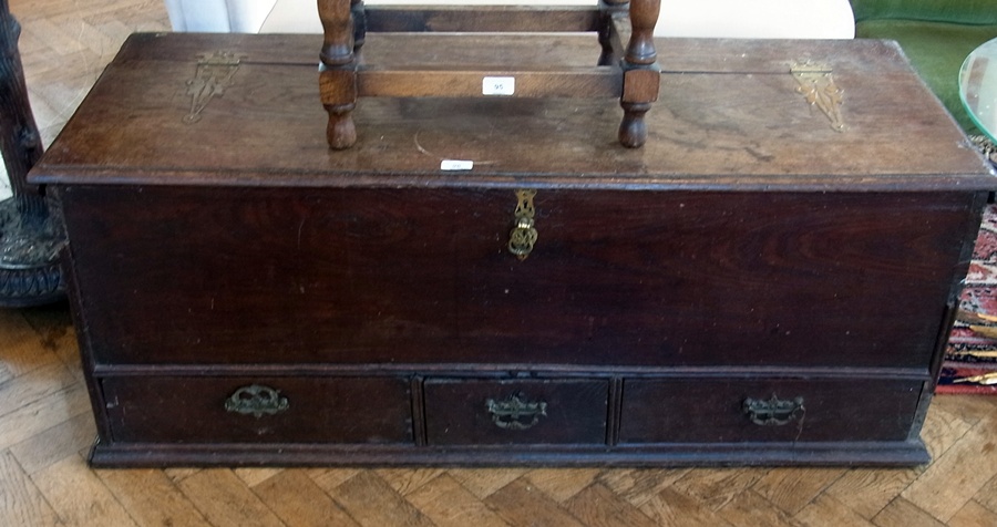 Antique oak coffer, with hinged lid, with three drawers below, brass handles, 123cm wide