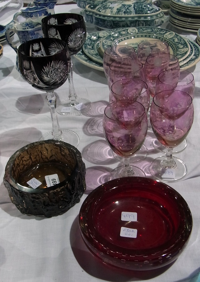 A 20th century red glass ashtray, a glass bark-effect bowl, set of eight cranberry glass vases and