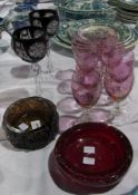 A 20th century red glass ashtray, a glass bark-effect bowl, set of eight cranberry glass vases and