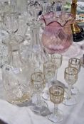 Two cut glass decanters and a set of six clear glasses with gilt decoration (worn) (8)