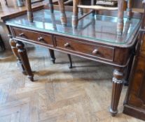 A Victorian mahogany writing table with two frieze drawers, reeded tapering legs, 106cm wide