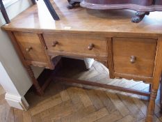 An early 20th century antique oak kneehole desk, an arrangement of three drawers around the