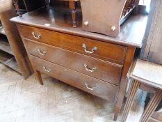 Early 20th century mahogany dressing chest of three drawers, with mirrorback on tapering supports