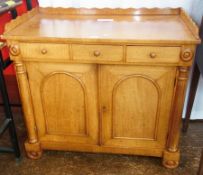 Victorian satinwood side cabinet having shaped raised tray top, three frieze drawers, cupboard below