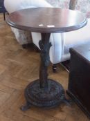 A Black Forest circular occasional table, on carved bark effect stand, on circular base