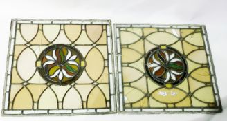 Pair leaded and stained glass panels, each square with stylised floral and foliate circular