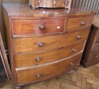 A mahogany chest of two short and three long drawers, with turned wood handles, on bun feet (af),