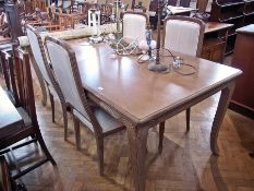 A modern lightwood dining table, on cabriole style supports, 100cm long together with a set of