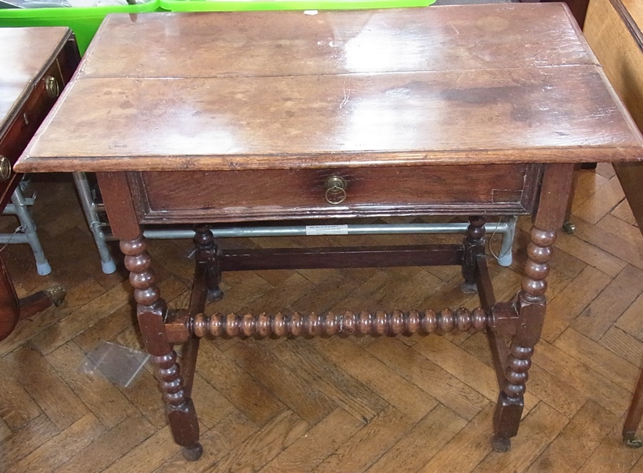 18th century oak side table with quadrant-mould edge fitted single frieze drawer with ring handle,
