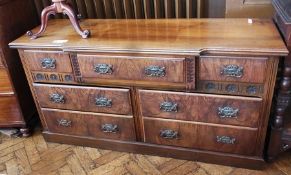Early 20th century walnut sideboard, with an arrangement of seven drawers, all with Art Nouveau